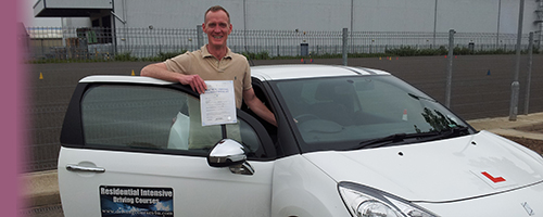 Picture of a man who has just passed his test